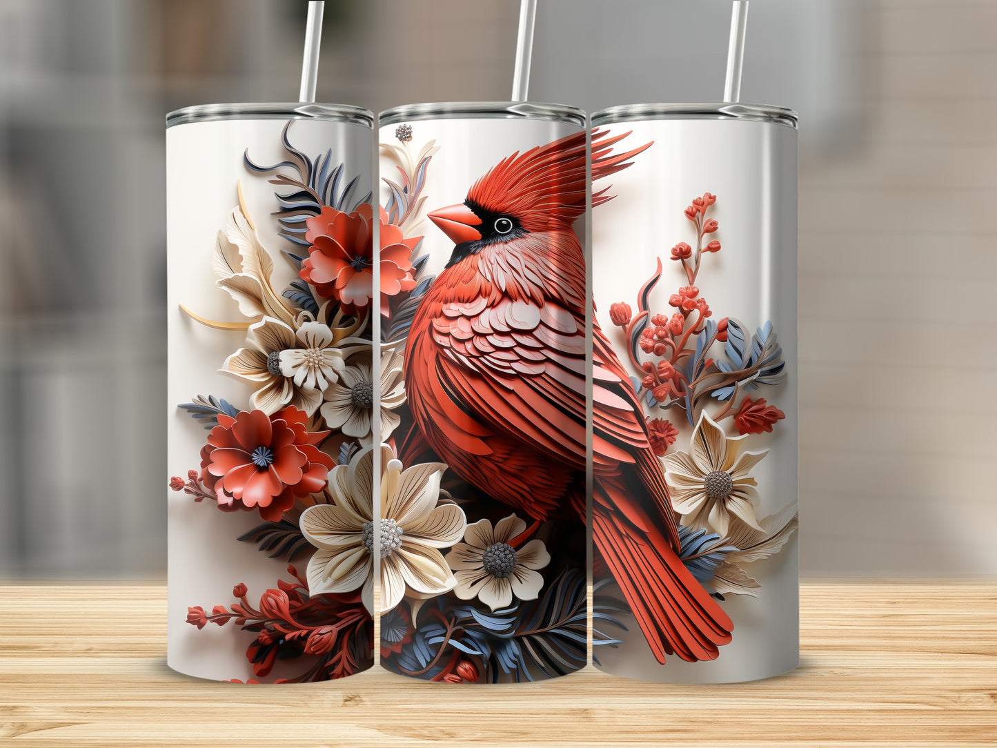 Cardinal bird and floral design on three white stainless steel tumblers.