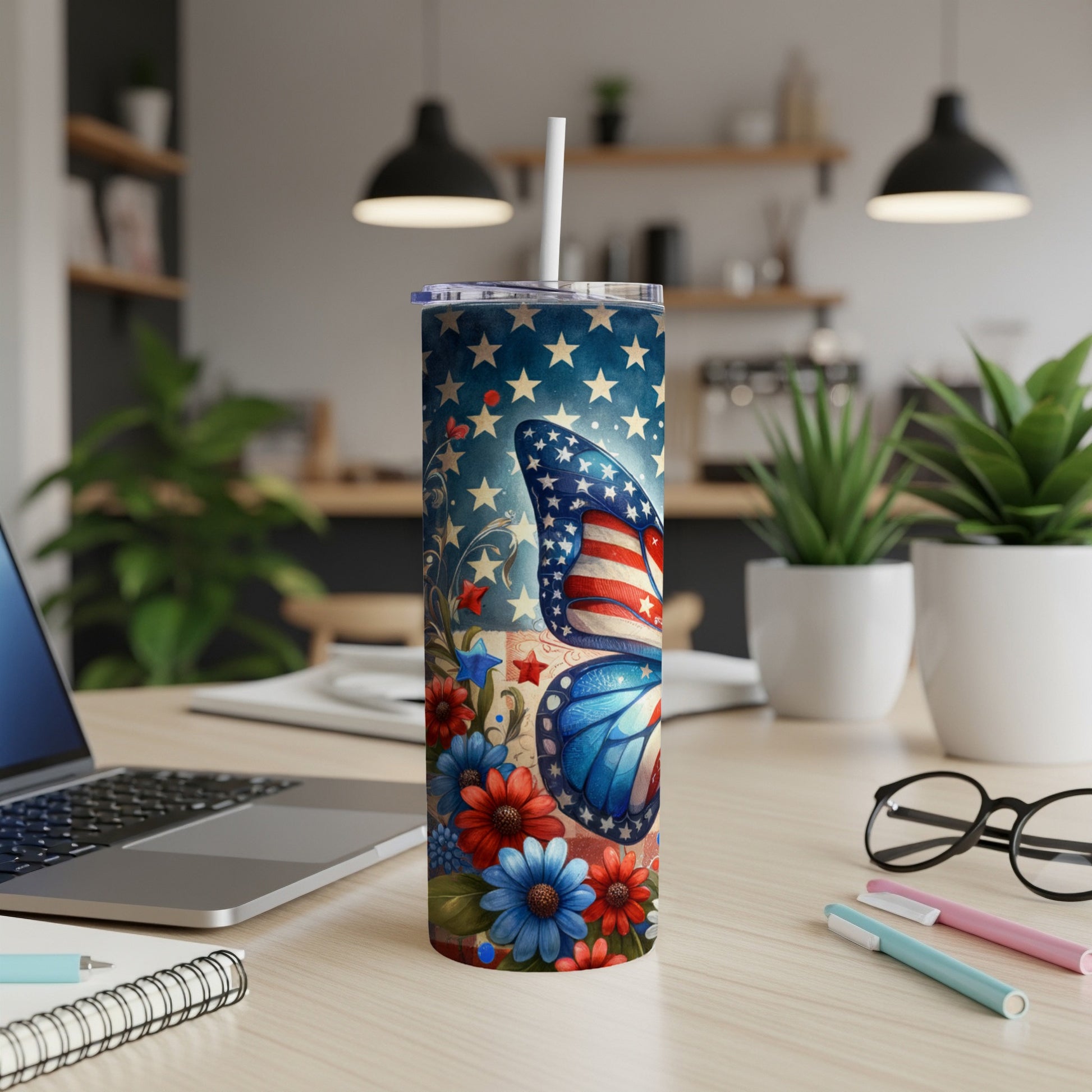 Butterfly with American flag wings on patriotic patterned tumbler.