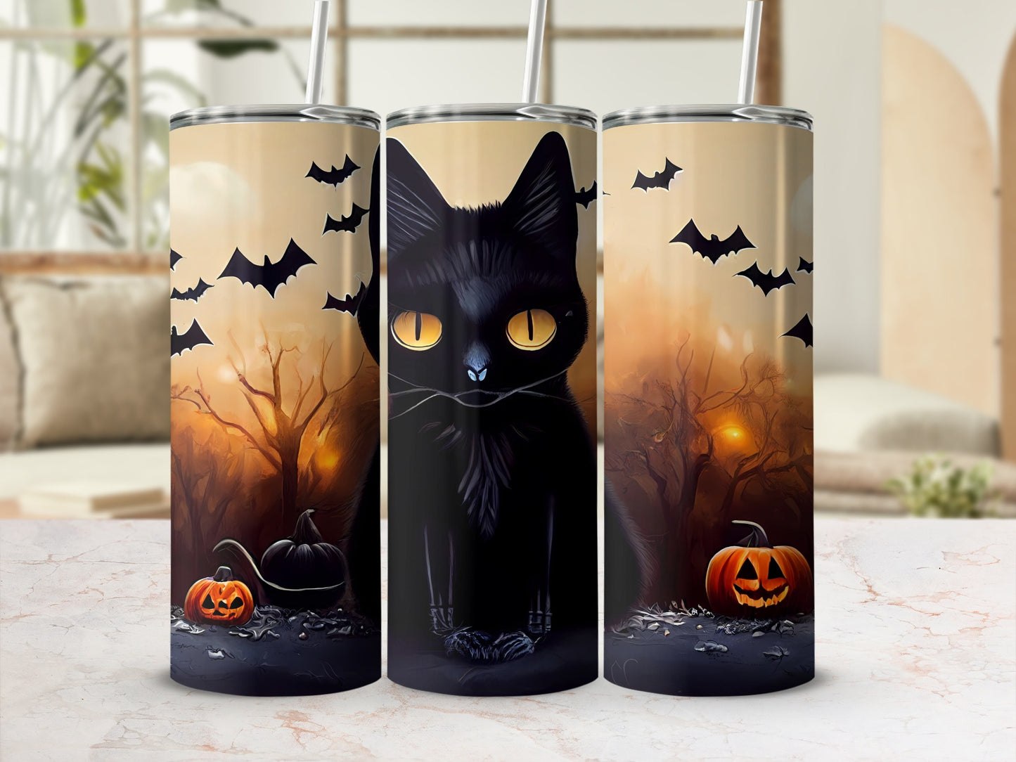 Black cat with pumpkins and bats on Halloween-themed tumblers.
