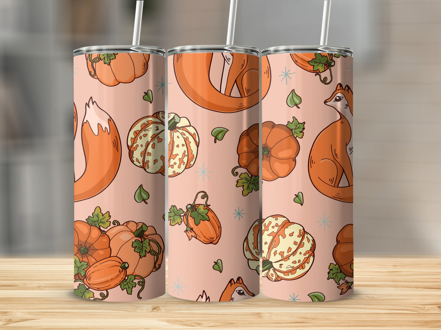 Pink tumbler with fox and pumpkin pattern.