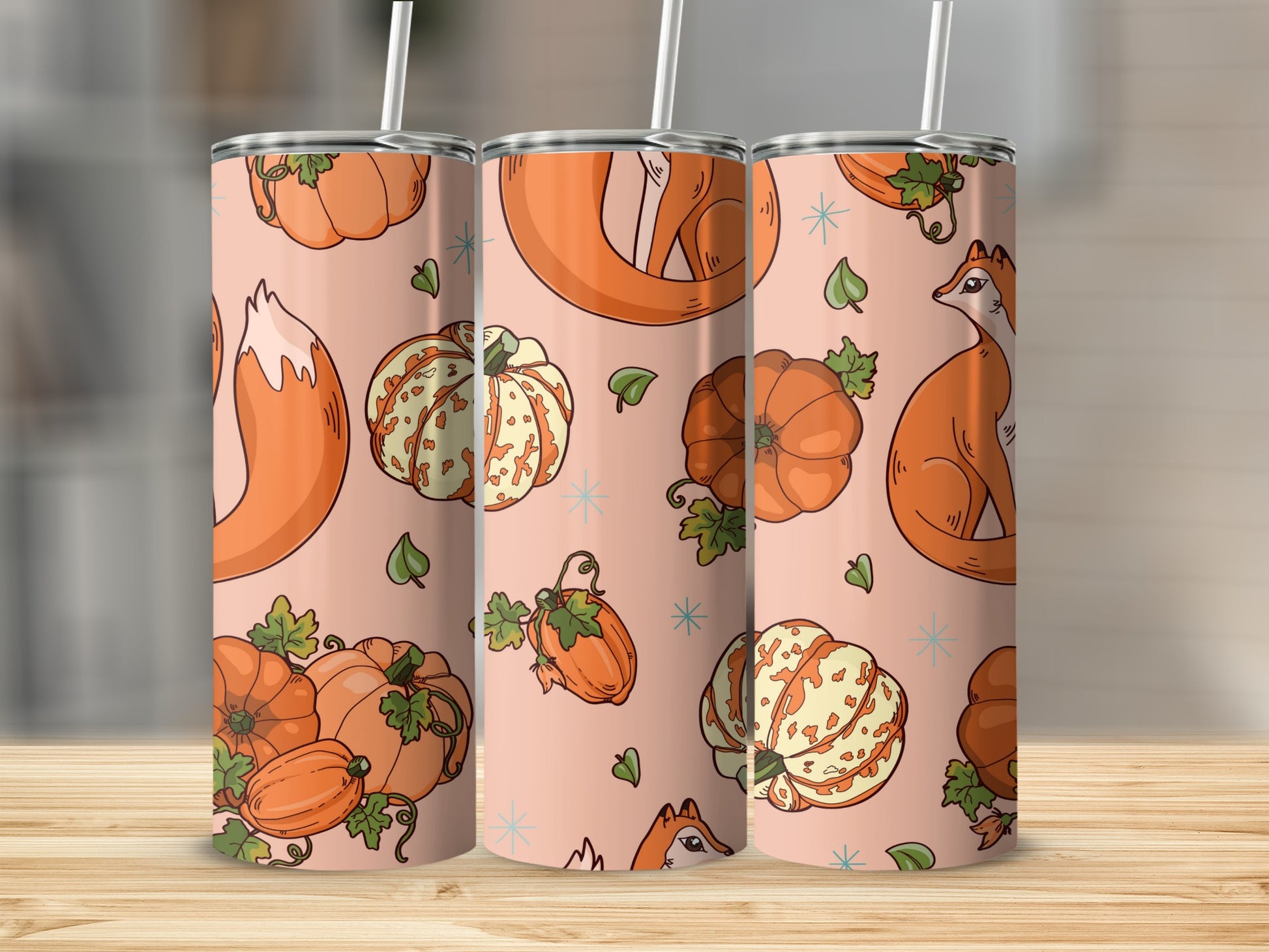Pink tumbler with fox and pumpkin pattern.