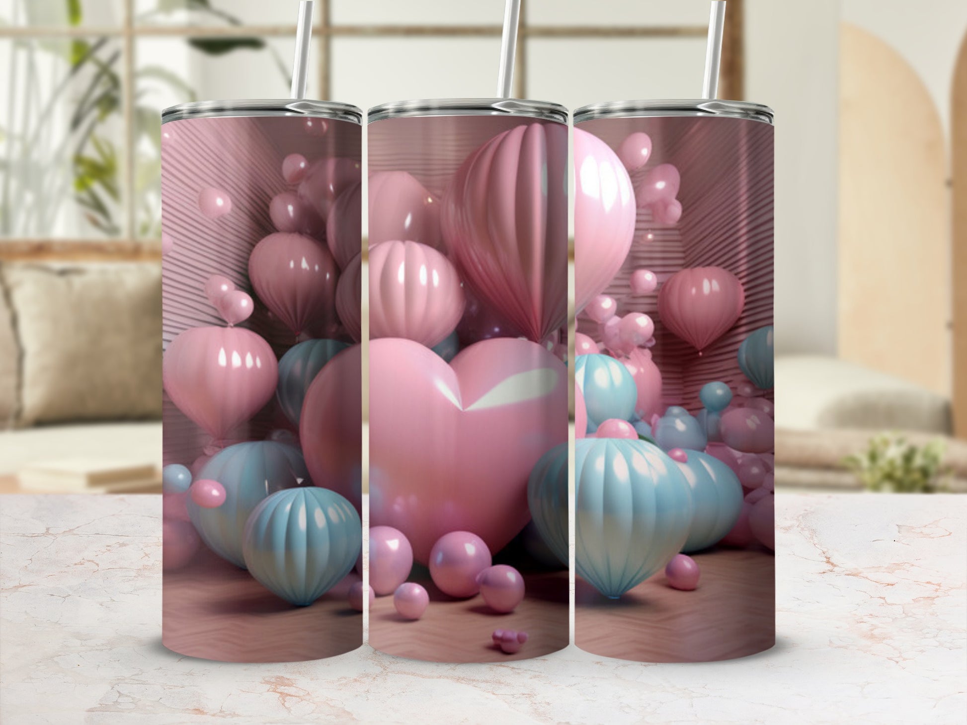 Pink and blue balloons surround a pink heart-shaped balloon on a tumbler.