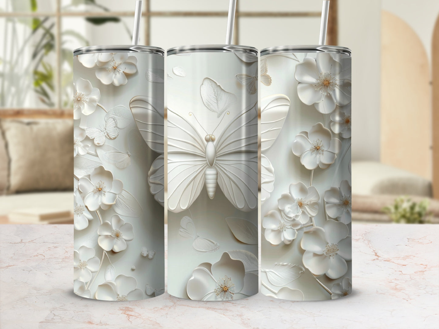 White tumbler with embossed butterflies and floral designs.