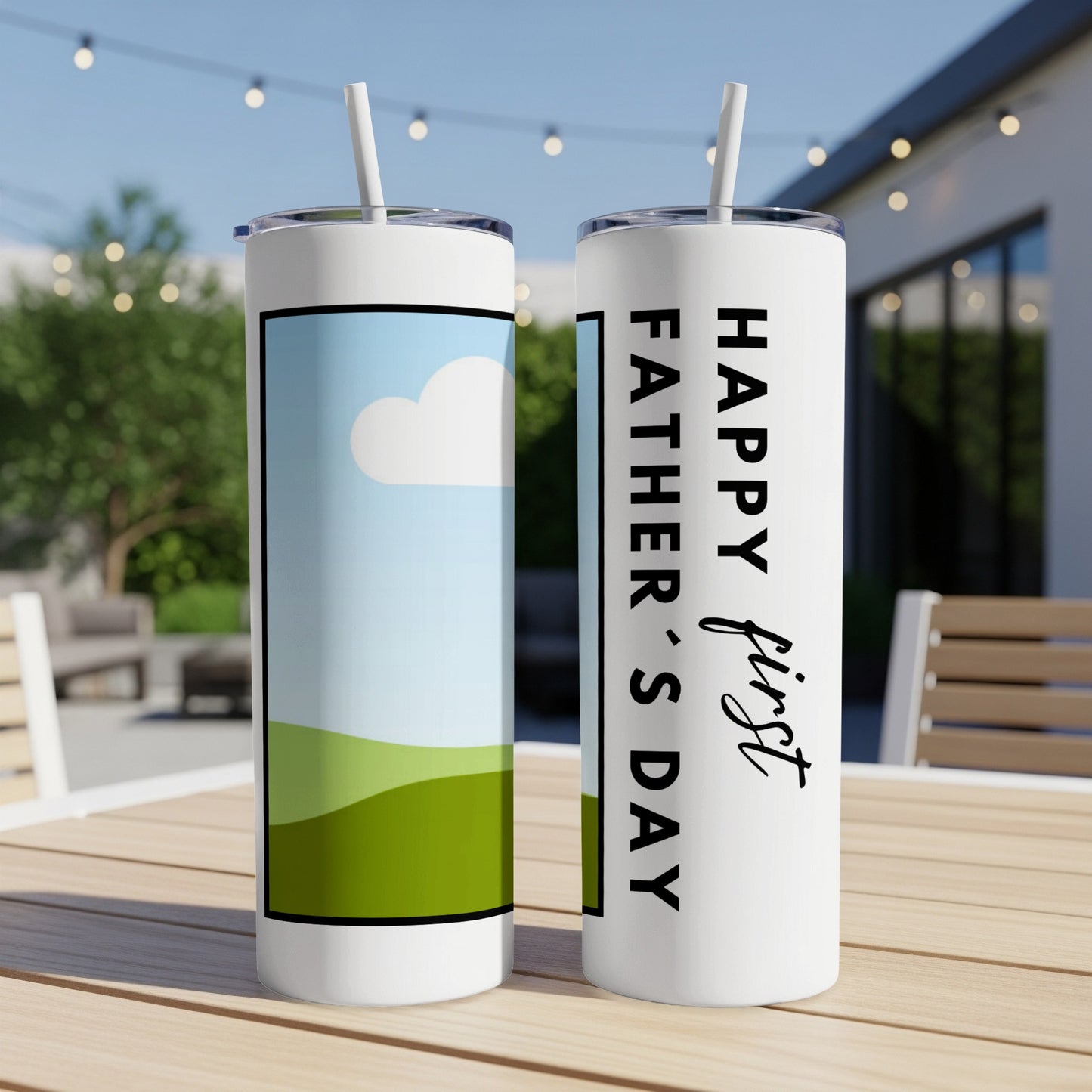 Two tumblers with straws sit on a table, one reads "Happy first Father's Day."