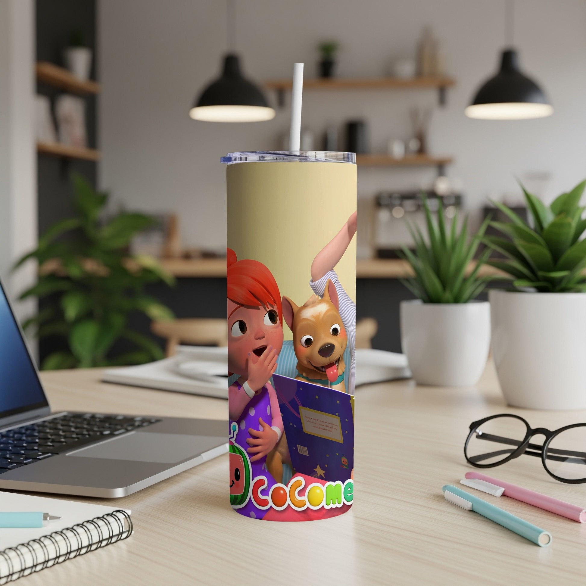 JJ and Cody from Cocomelon reading a book on a tumbler cup.