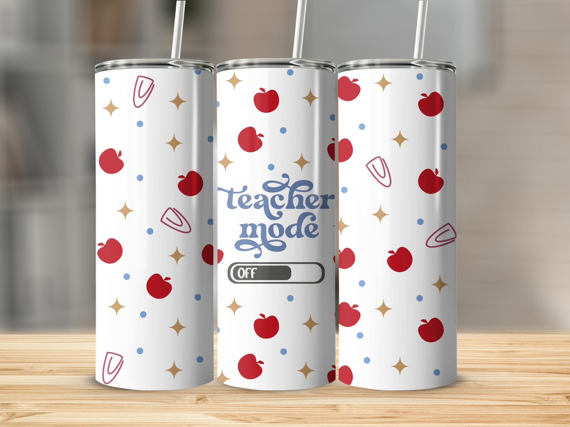 Teacher mode tumbler with apples, stars, and paper clips pattern.