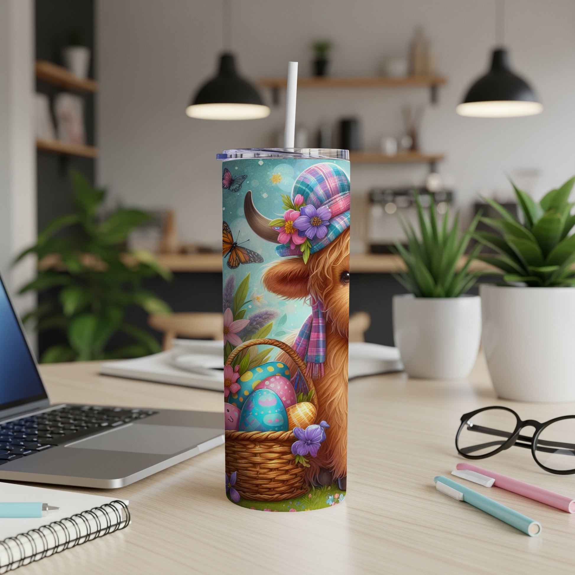 Highland cow with Easter eggs and butterflies on a tumbler.