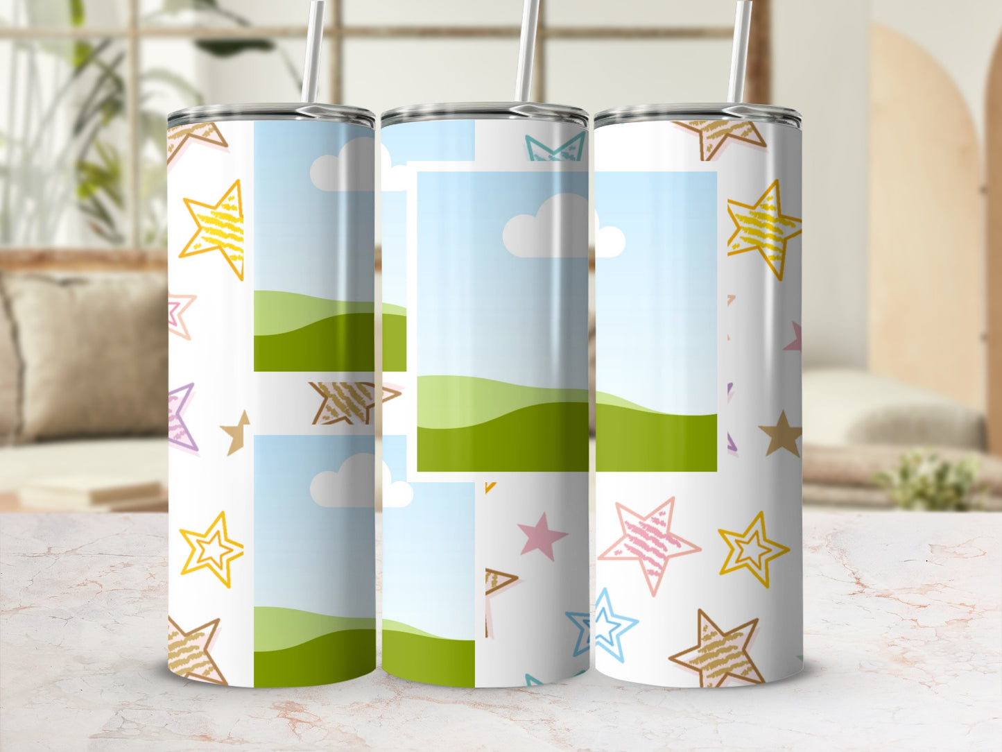 Three tumblers with colorful stars and photo frames on a marble surface.