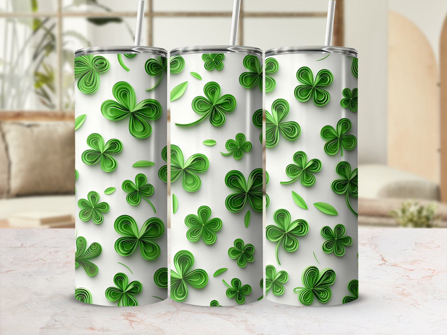 Three green shamrock pattern tumblers with straws.