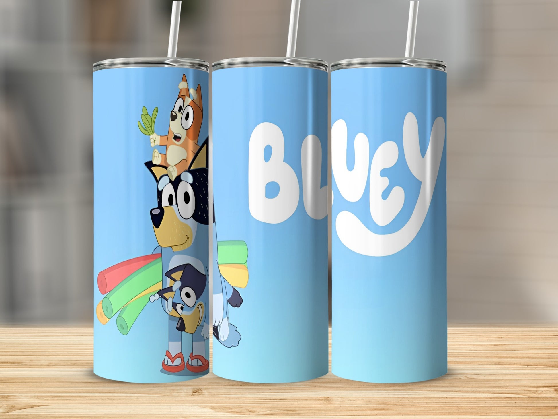 Bluey tumbler with characters Bluey, Bingo, and Bandit on a light blue background.
