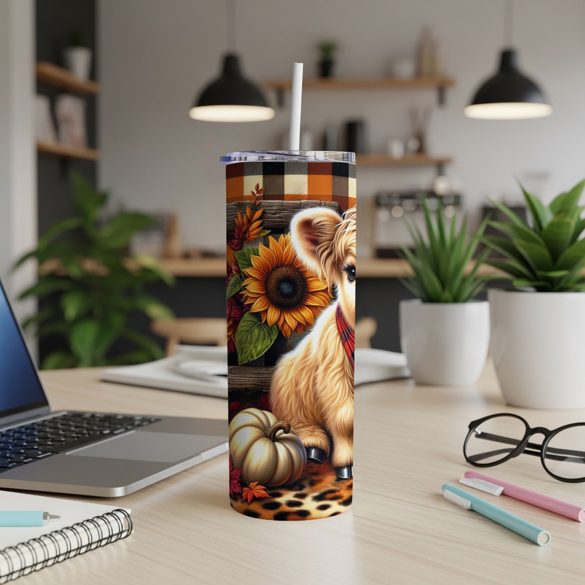 Highland cow with sunflowers and pumpkins on a plaid pattern tumbler.