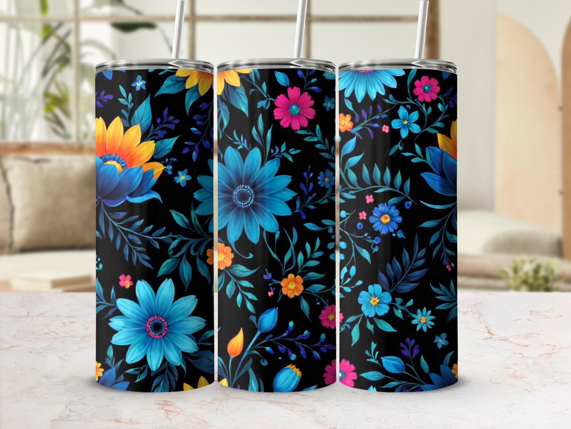 Three tumblers with a black background and a colorful floral pattern.
