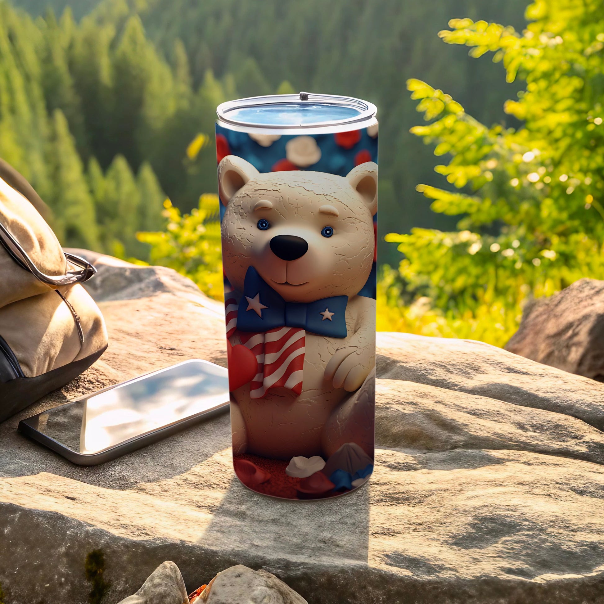 White bear wearing a patriotic bow tie on a tumbler outdoors.