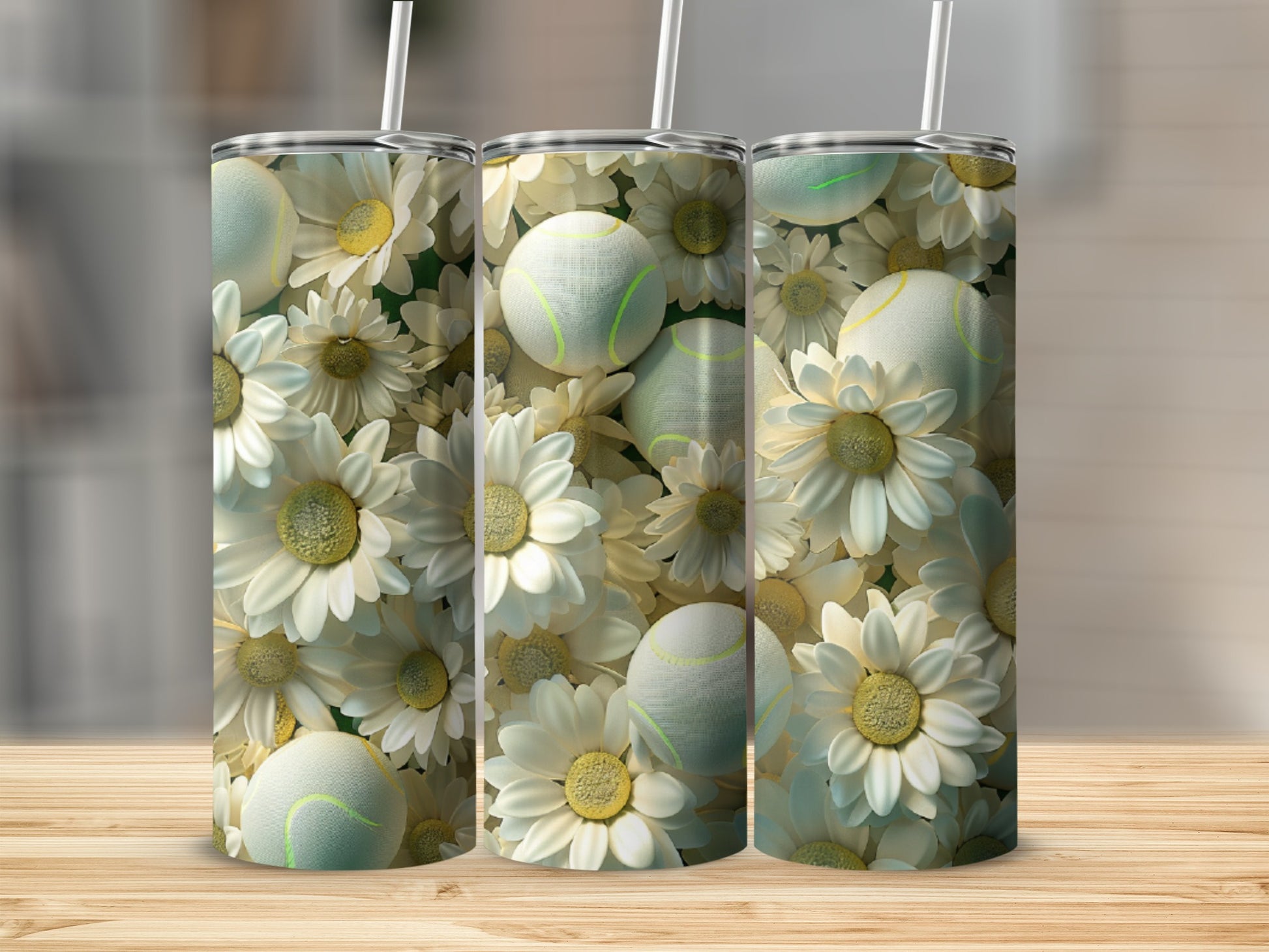 Three tumblers with white daisy and tennis ball floral design.