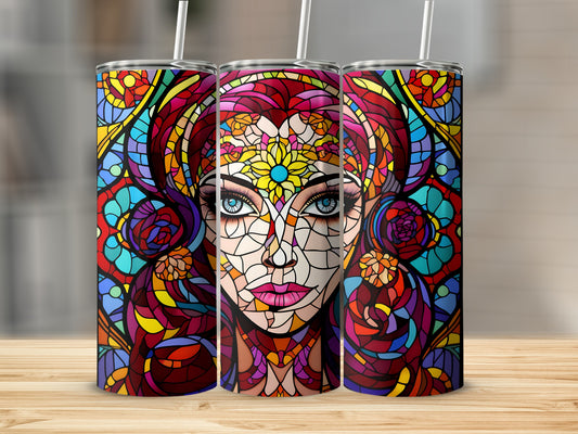 Stained glass tumbler featuring a woman's face with colorful abstract patterns.