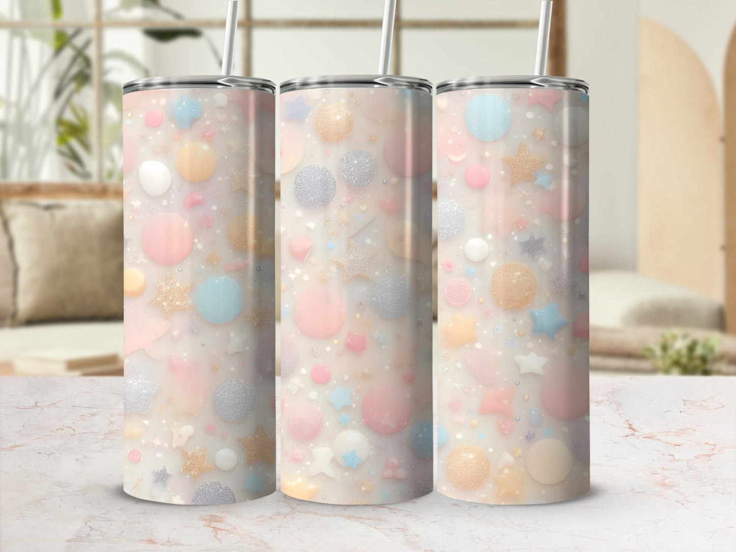 Three pastel tumblers with glittery star and dot patterns.