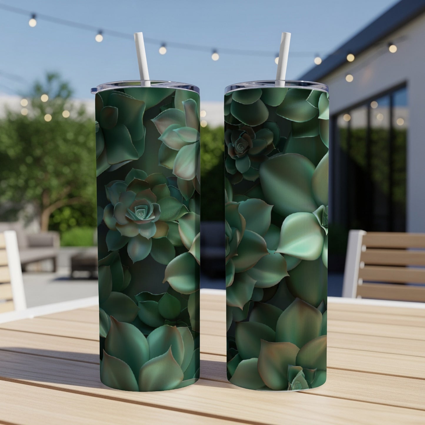 Two tall, narrow tumblers with a succulent plant pattern on a wooden table.