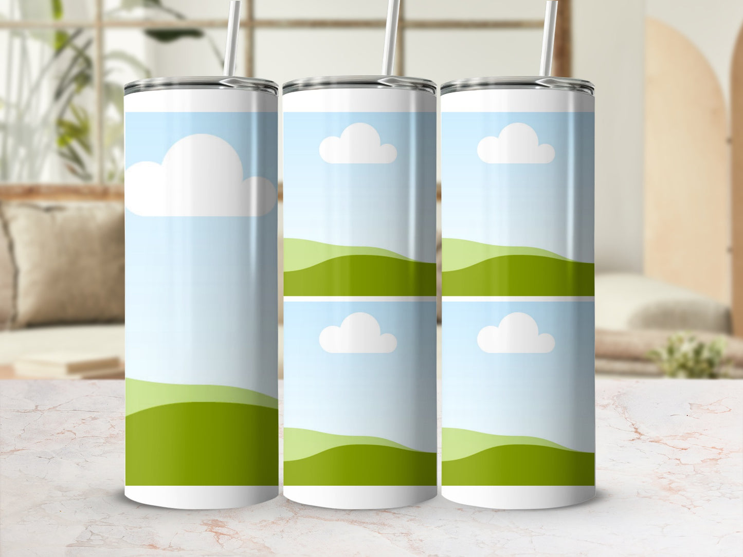 Three tumblers with a green landscape and white clouds design.