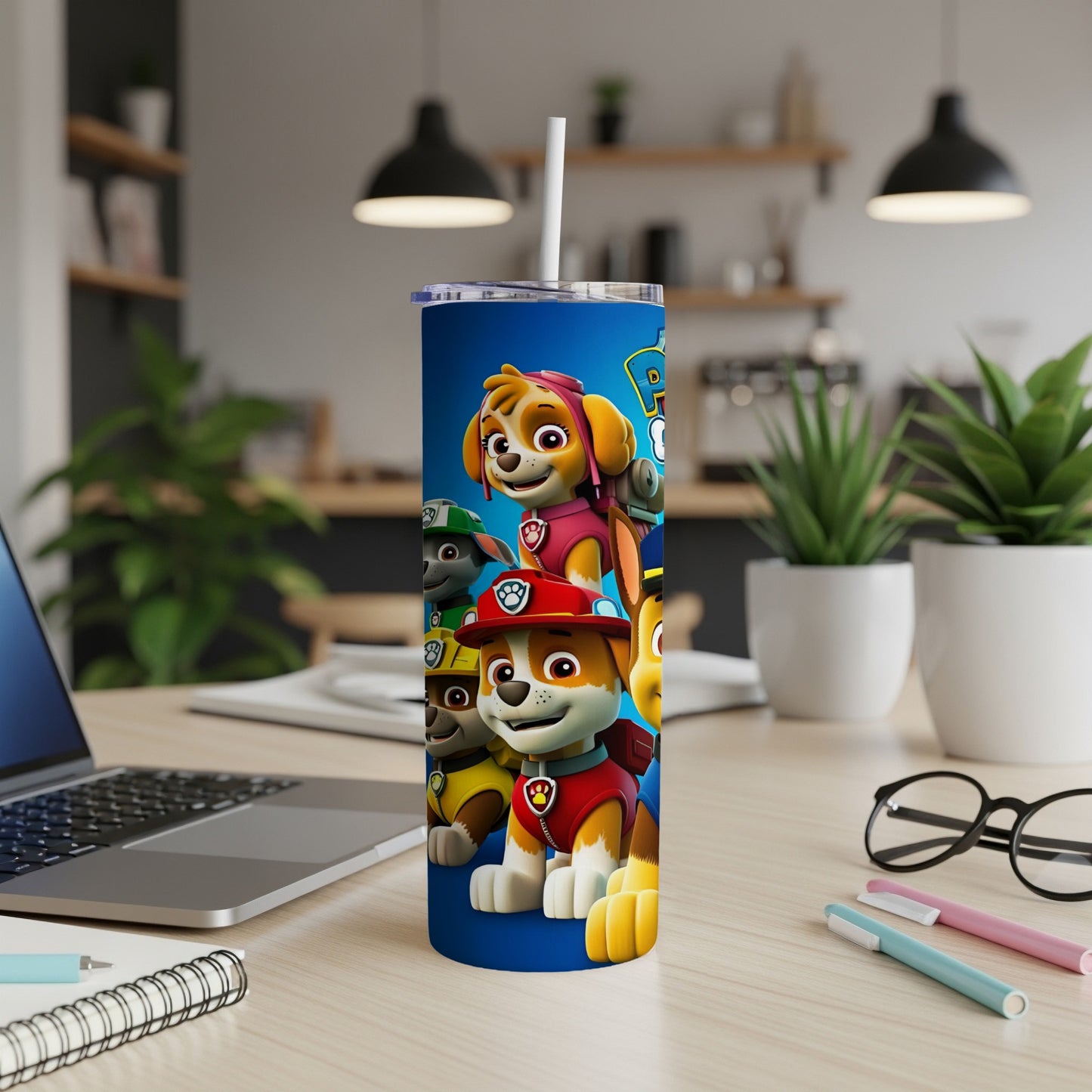 Paw Patrol characters on a blue tumbler with a white straw.