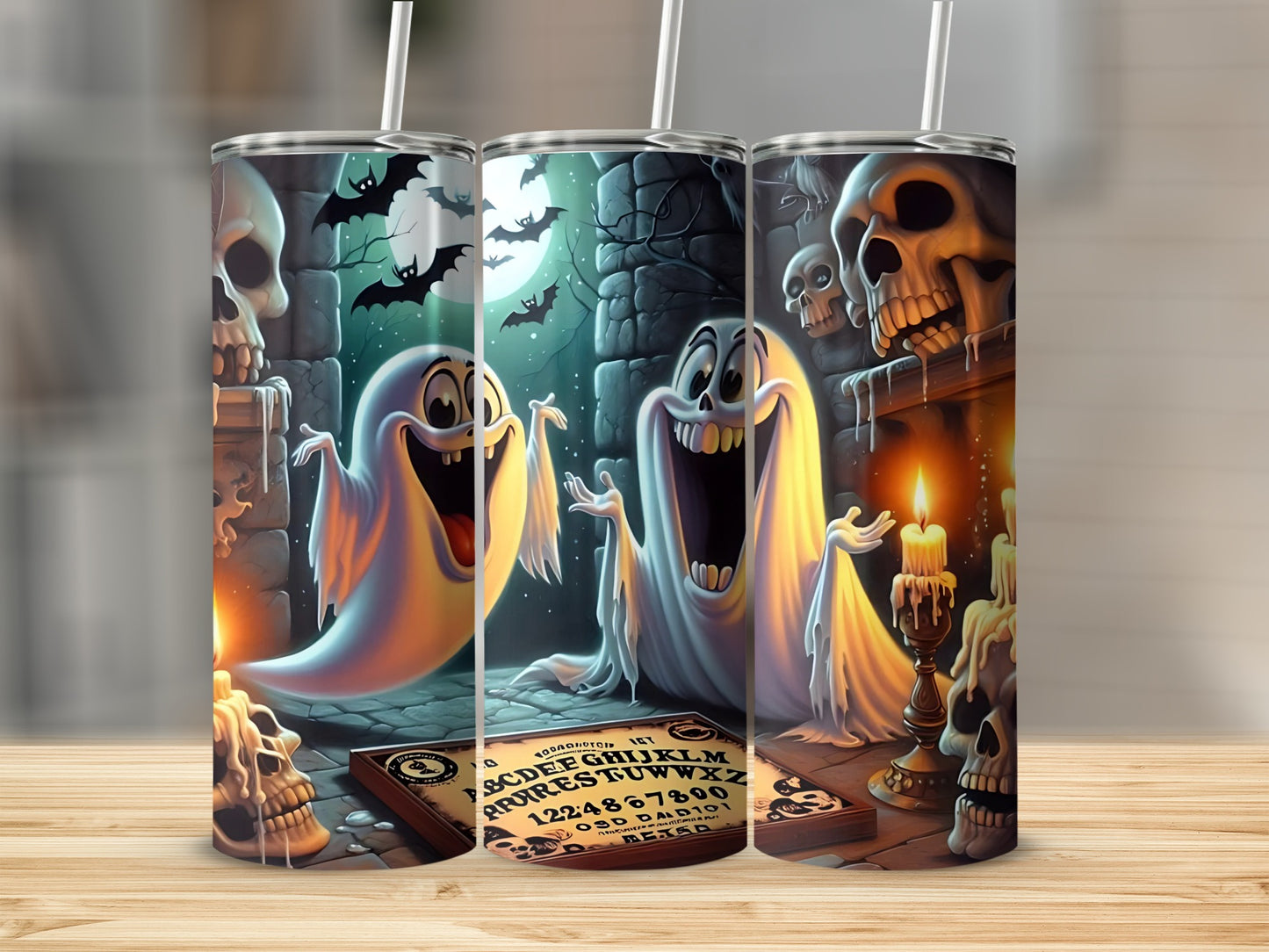 Ghosts and skulls on a Halloween-themed tumbler with a Ouija board.