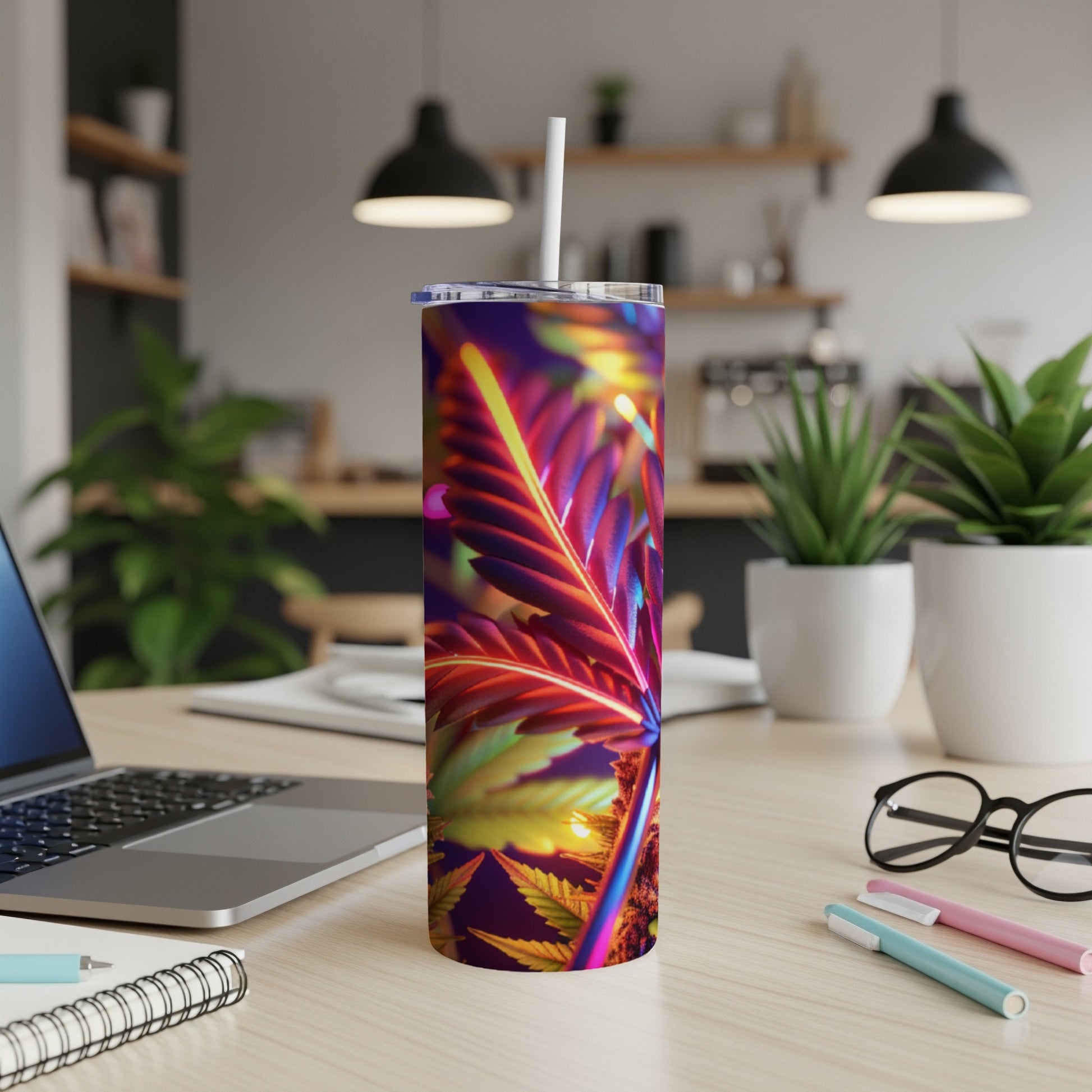 Tumbler with vibrant, colorful cannabis leaf design.