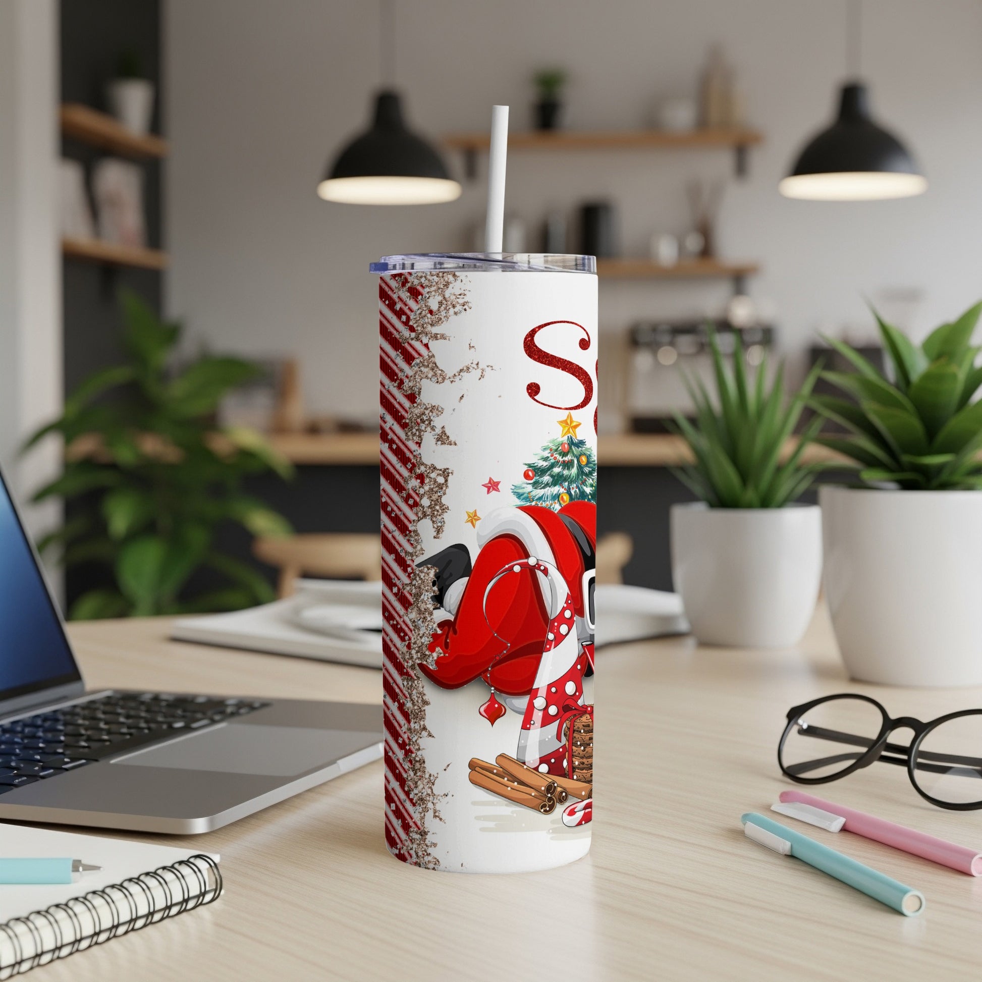 Santa Claus design on a white glitter tumbler with straw.