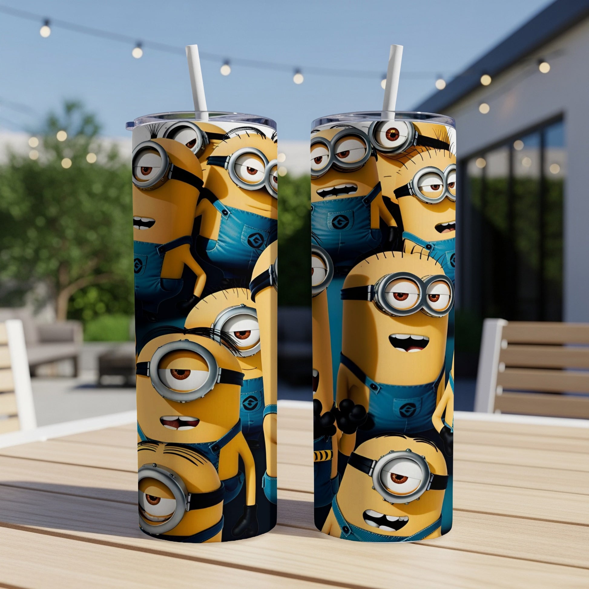 Two Minion-themed tumblers with cartoon characters on blue overalls.