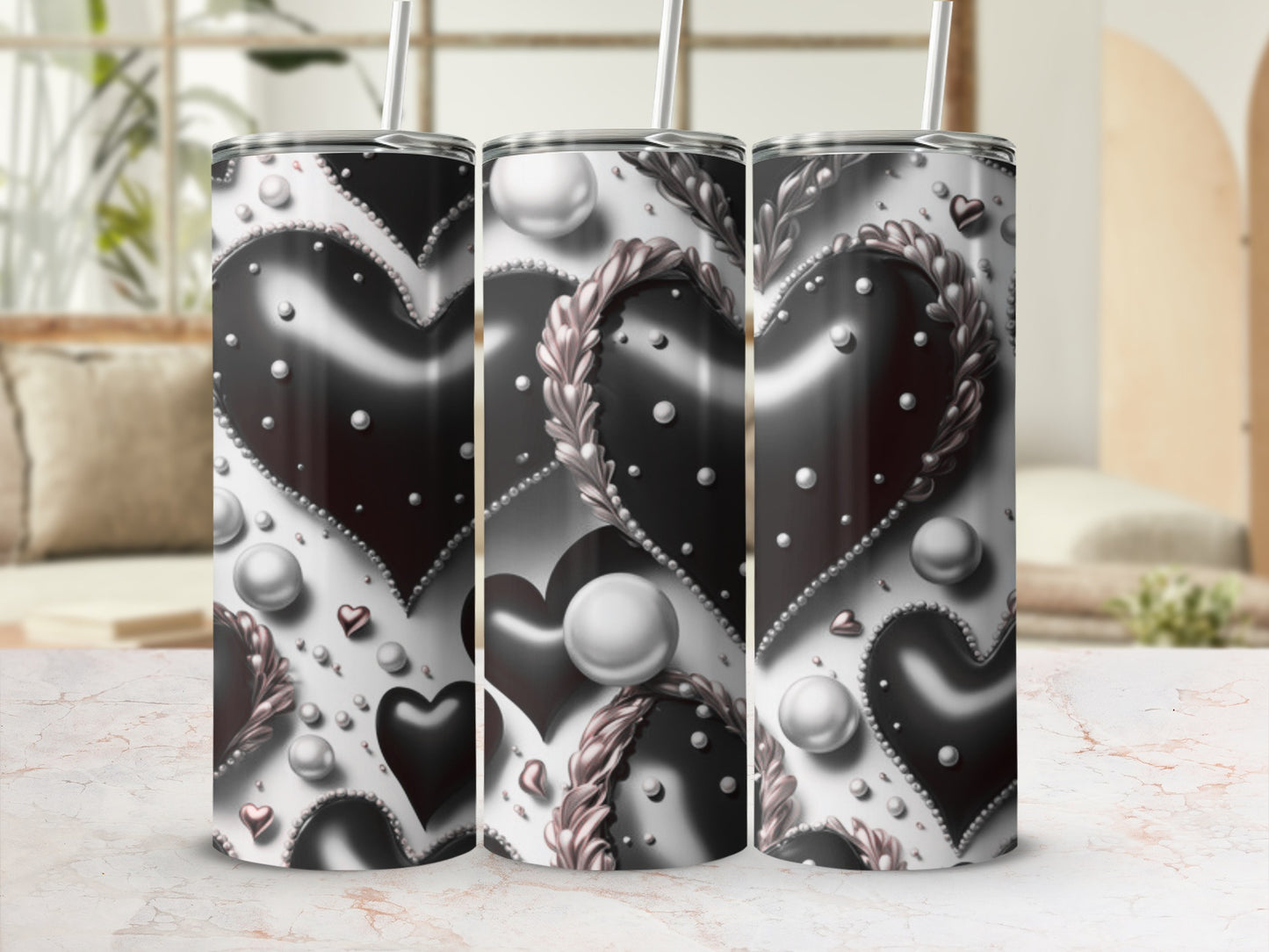 Silver and black hearts pattern on a 30oz tumbler with straw.