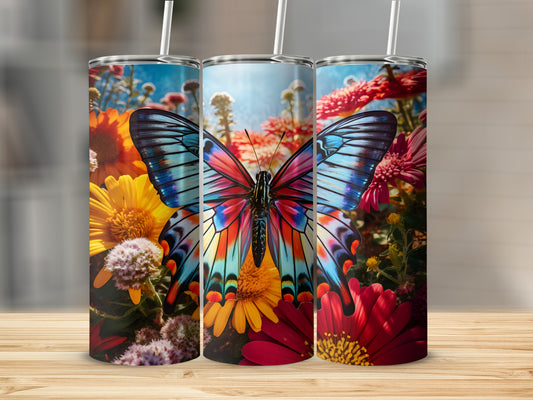 Three tumblers featuring a colorful butterfly surrounded by vibrant flowers.