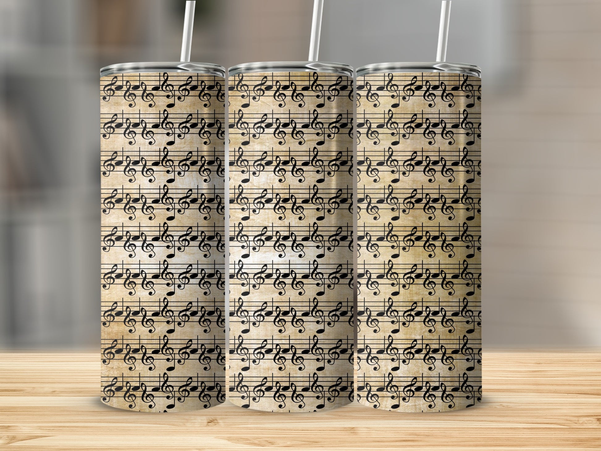 Three tumblers with a vintage sheet music pattern featuring treble clefs and musical notes.