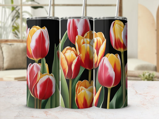 Three tumblers decorated with red and yellow tulips on a black background.