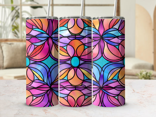Three stained glass tumblers with floral patterns in bright blues, purples, and oranges.