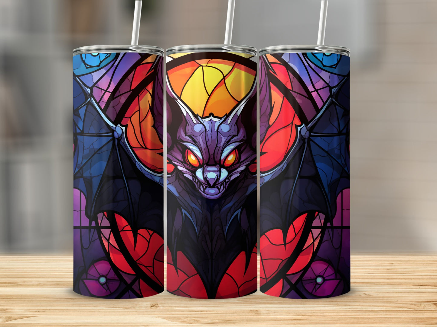 Stained glass bat design on three tumblers with straws.