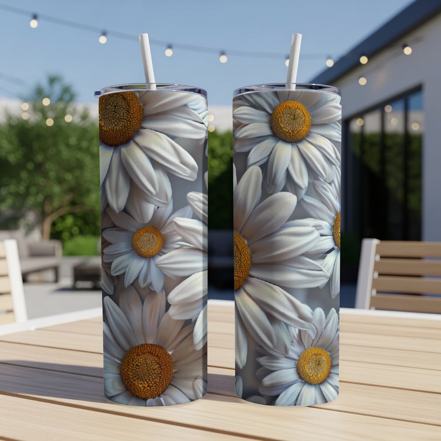 Two tumblers adorned with a repeating pattern of white daisies with yellow centers.