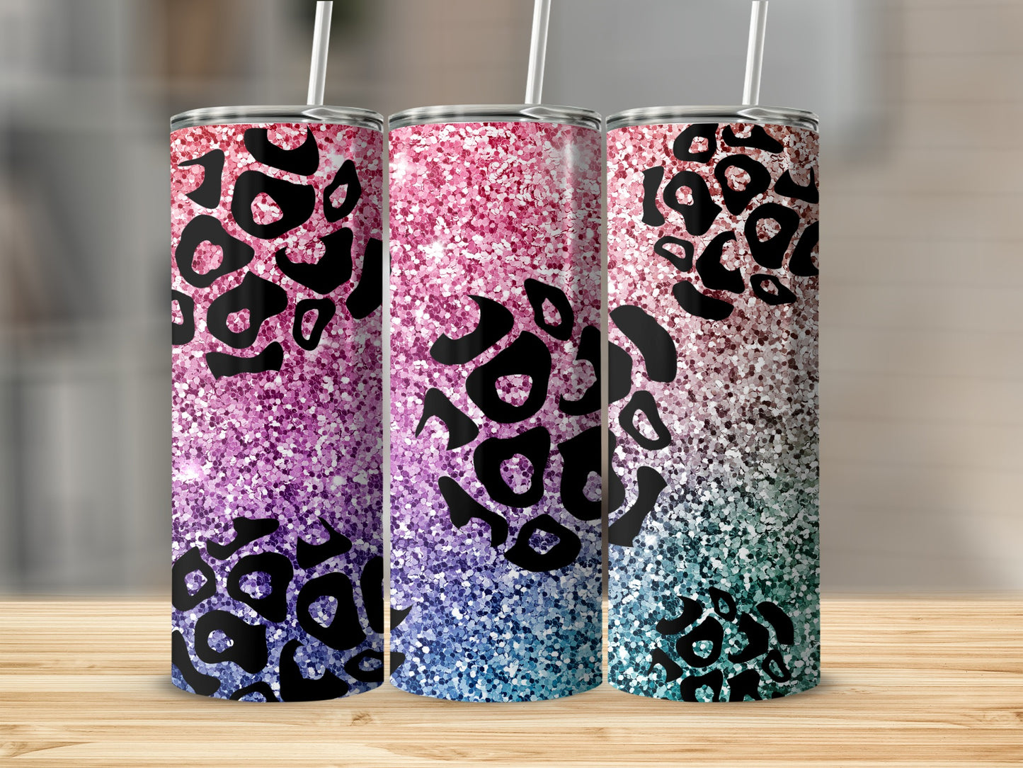 Three tumblers with pink, blue, and teal glitter and leopard print.