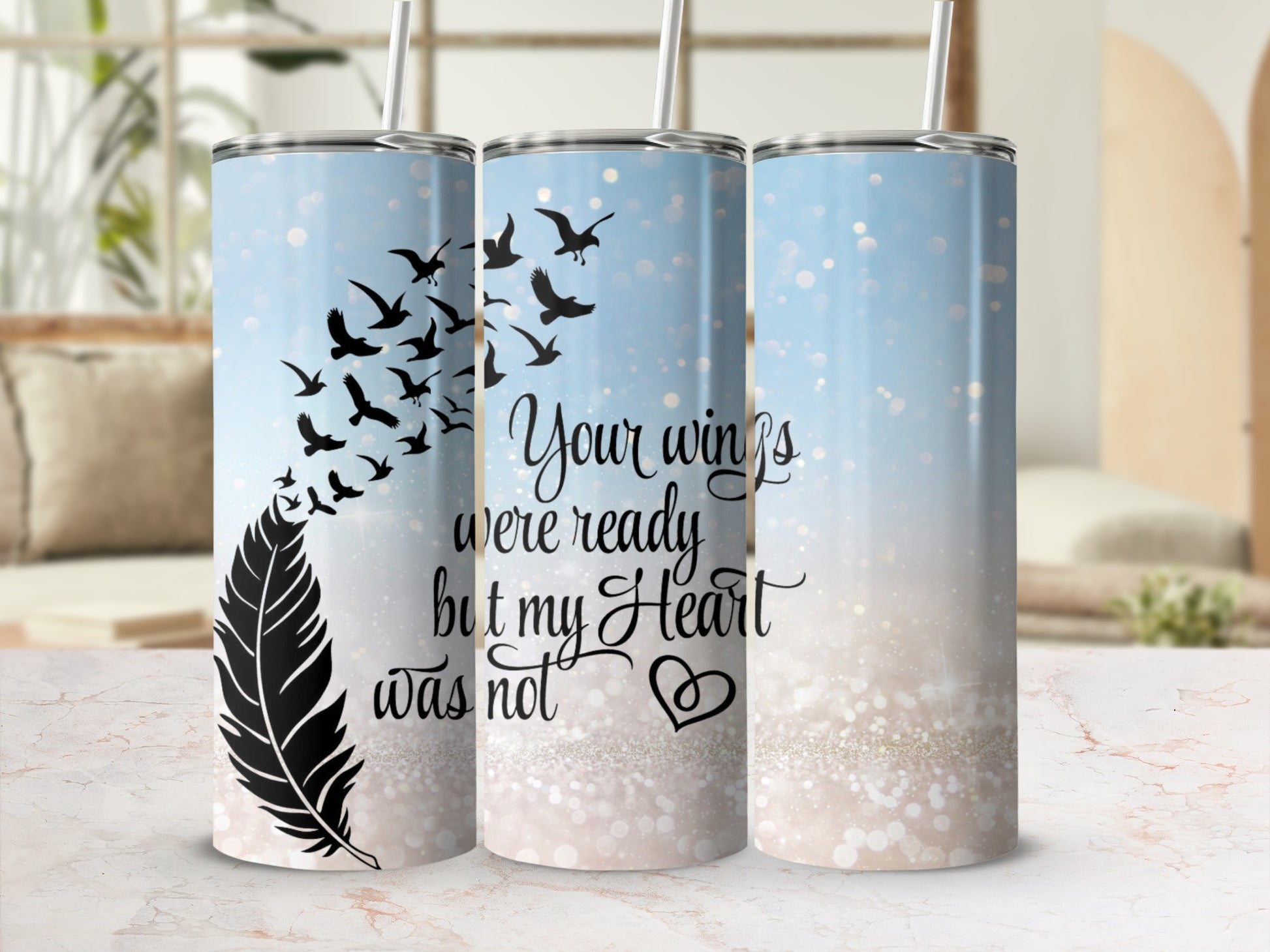 Feather and birds design with quote "Your wings were ready but my heart was not" on a tumbler.