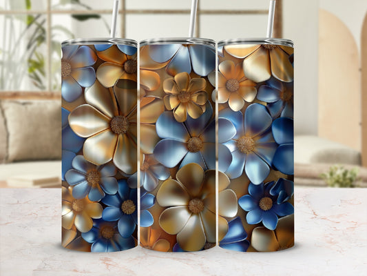 Three tumblers with blue and gold floral design, blurred background.