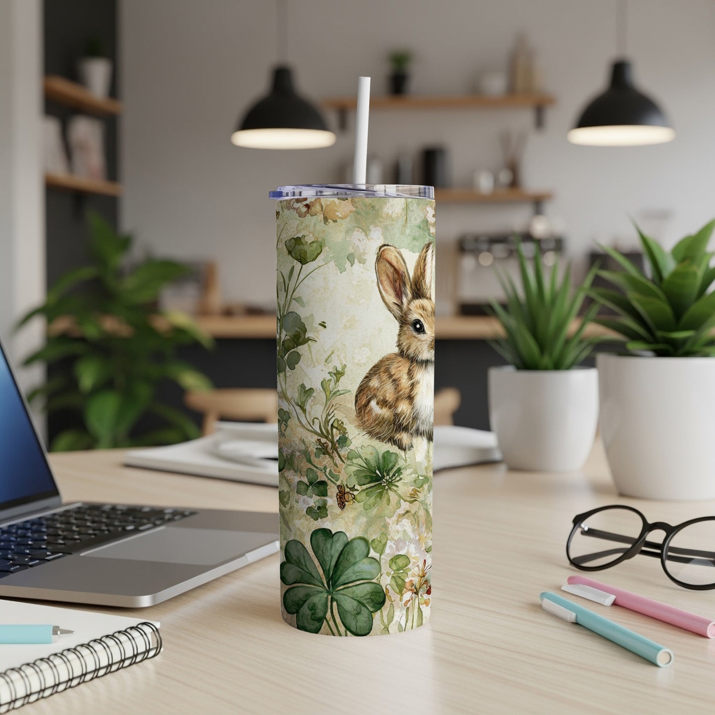 Rabbit and clover pattern on a white tumbler with a straw.