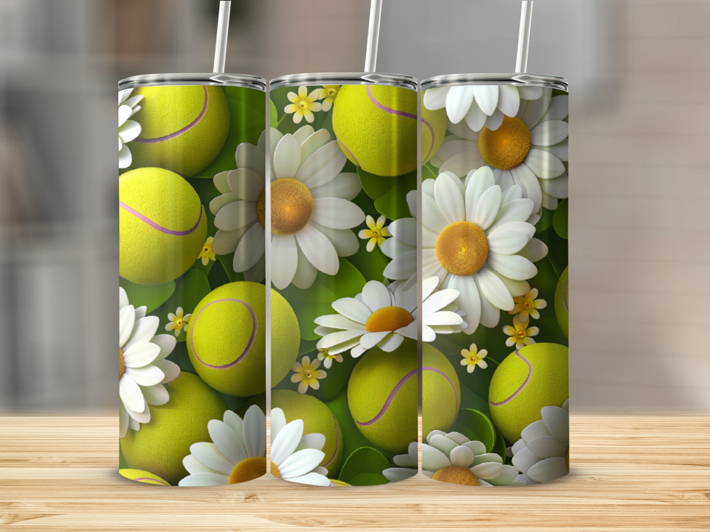 Three tumblers with tennis balls and daisies design.