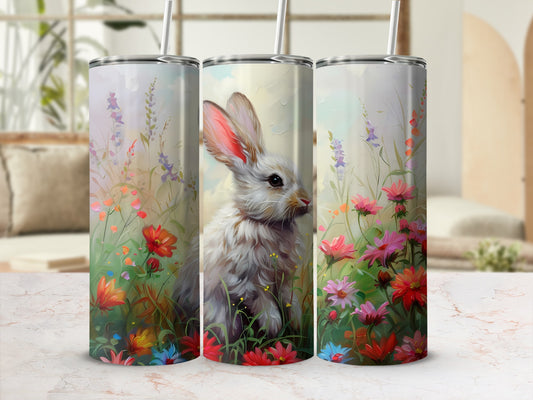 Bunny among colorful spring flowers on a white tumbler.