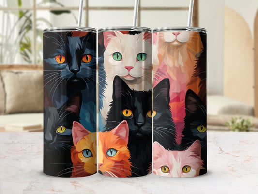 Three cat-themed tumblers with colorful cat faces on a marble surface.