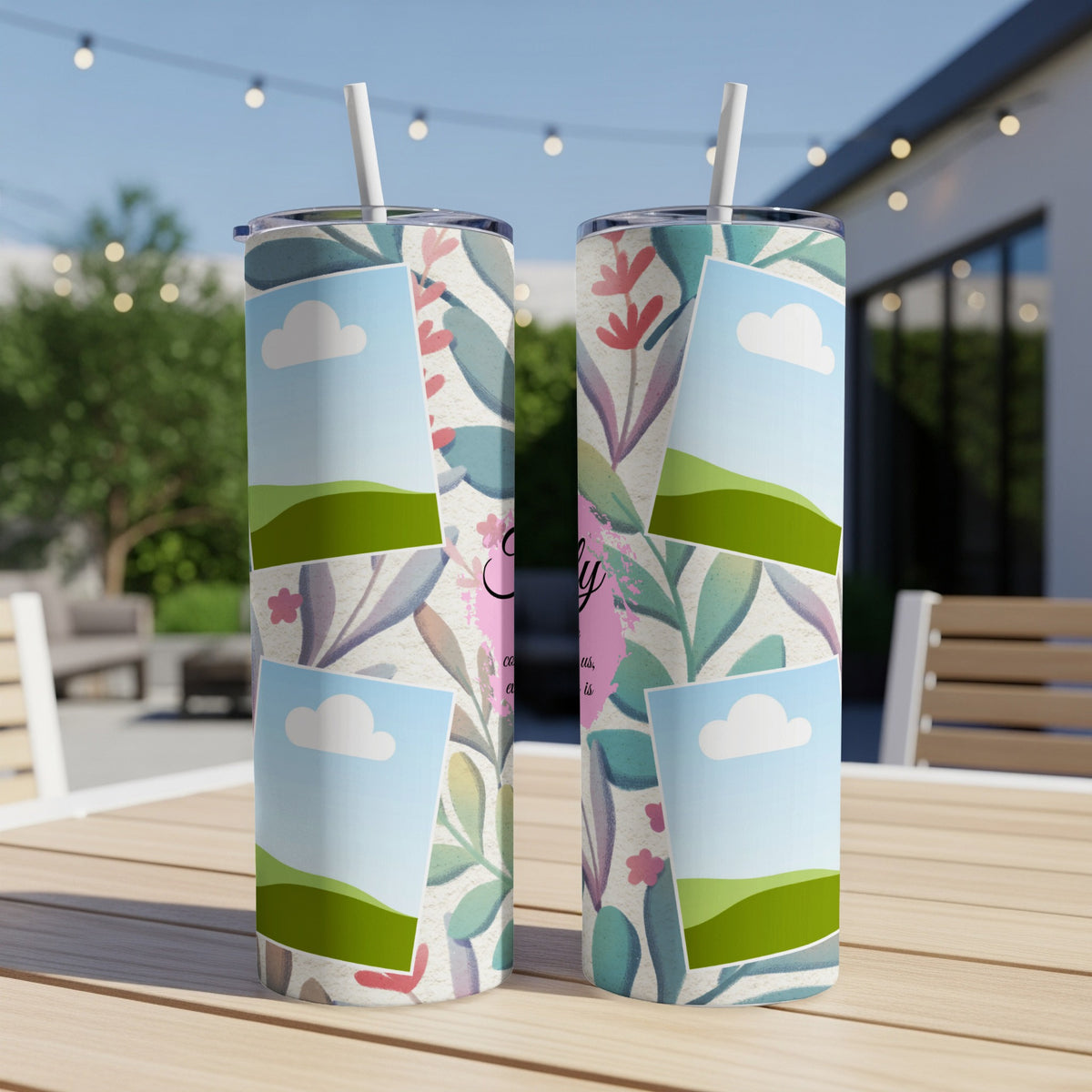 Two tumblers with floral pattern, photo frames, and script text on a table.