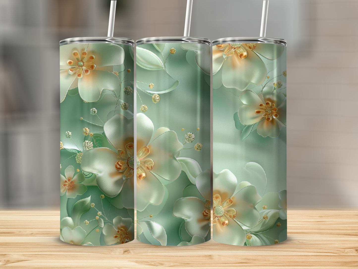 Three tall tumblers with green, floral art design.