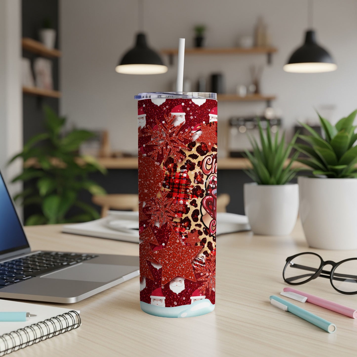 Red Christmas tumbler with Santa, snowflakes, and leopard print patterns.