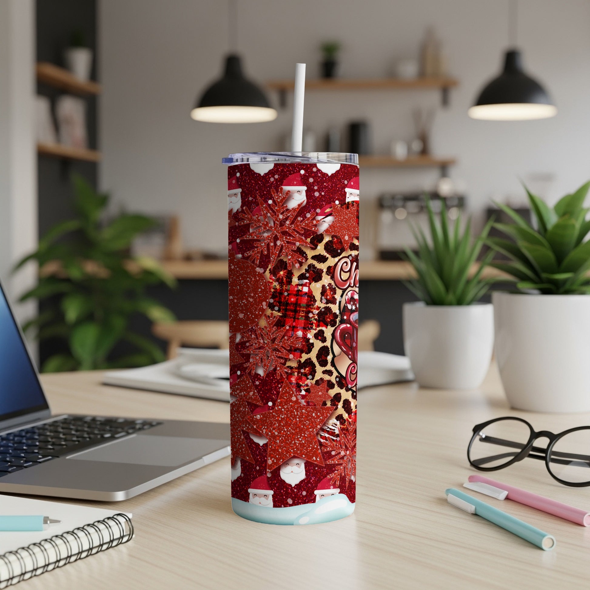 Red Christmas tumbler with Santa, snowflakes, and leopard print patterns.