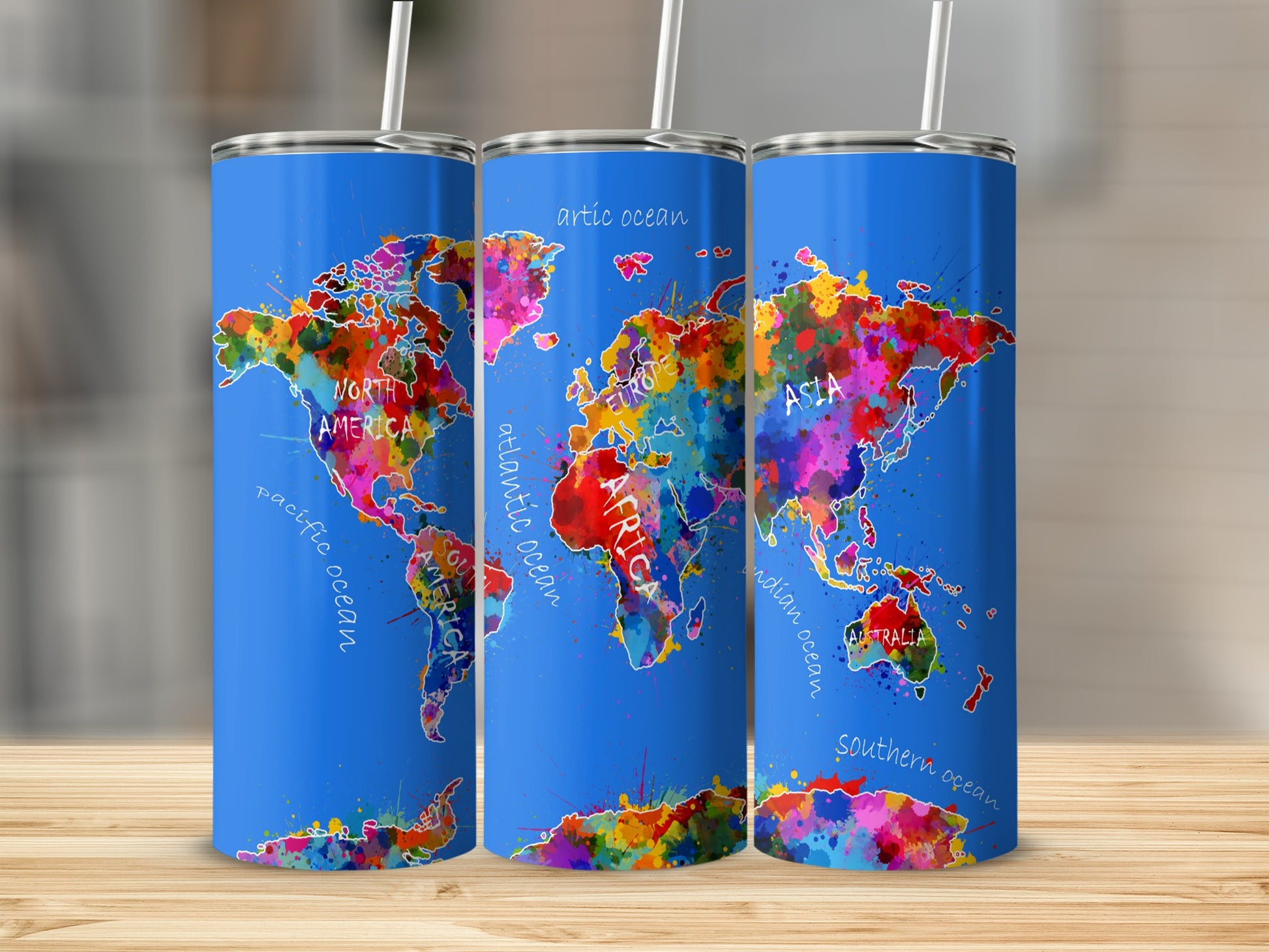 Blue tumblers with colorful watercolor world map design including continents and oceans.