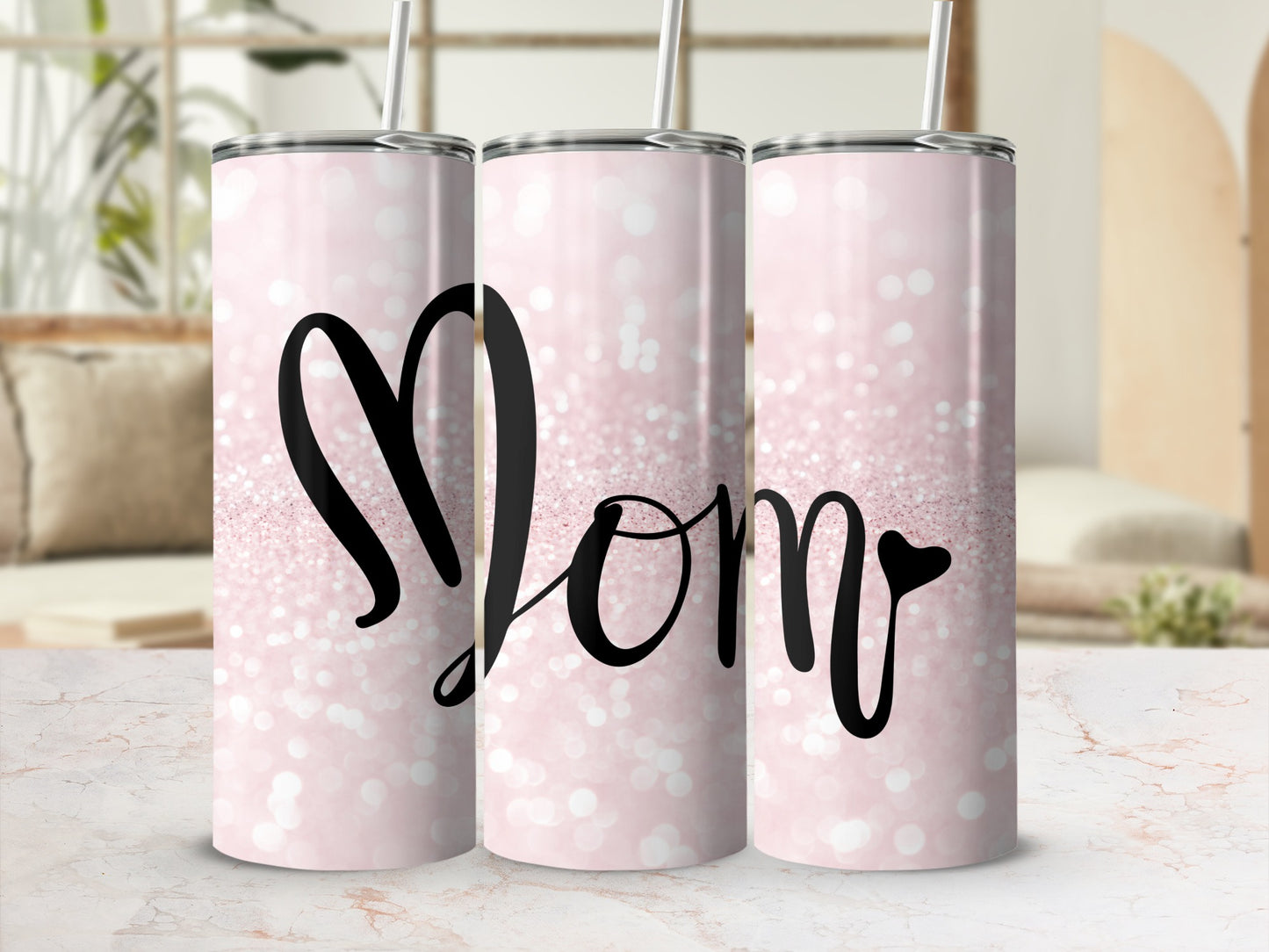 Pink glitter tumbler with "Mom" in cursive text.