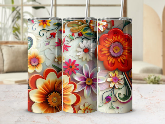 Floral patterned tumbler with bright orange and yellow flowers and green leaves.
