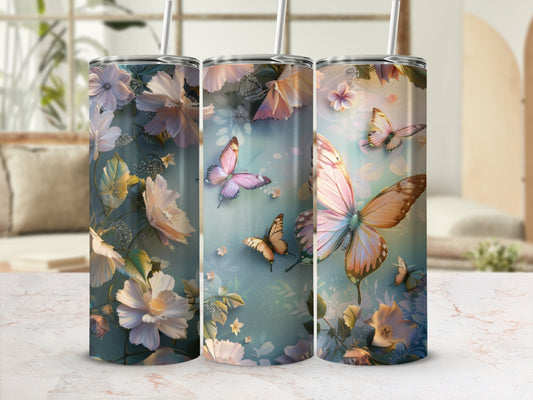 Floral and butterfly design on a stainless steel tumbler with straw.