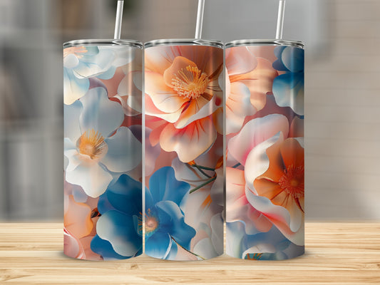Three tumblers with floral patterns in blue, orange, and white.